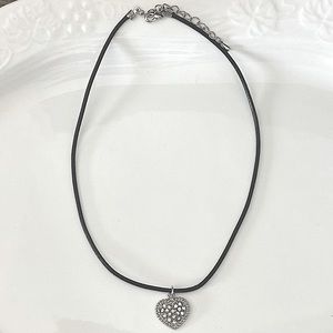Black leather choker necklace in silver-tone. Heart charm length: 14 inch